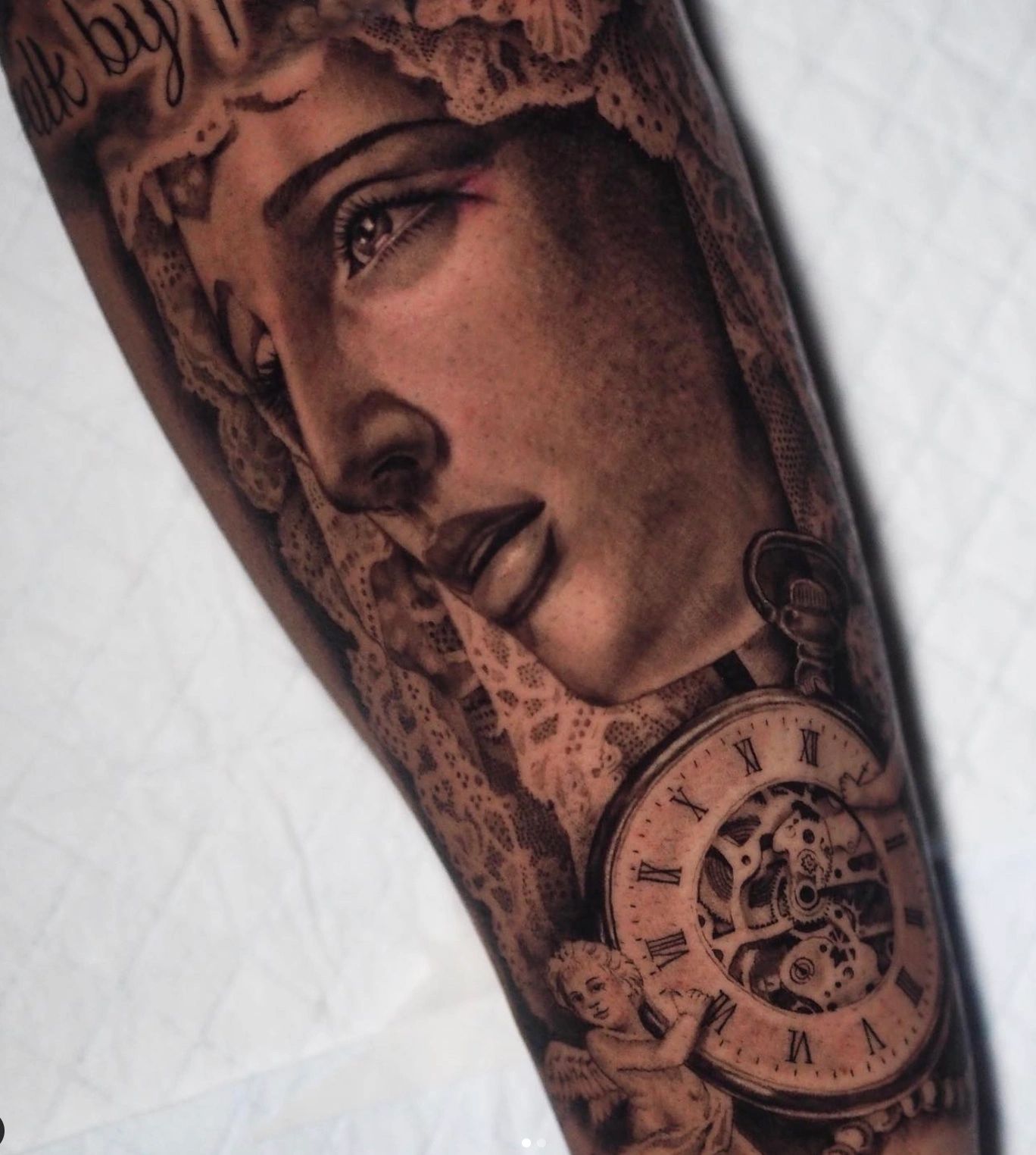 Realistic tattoo of the Virgin Mary